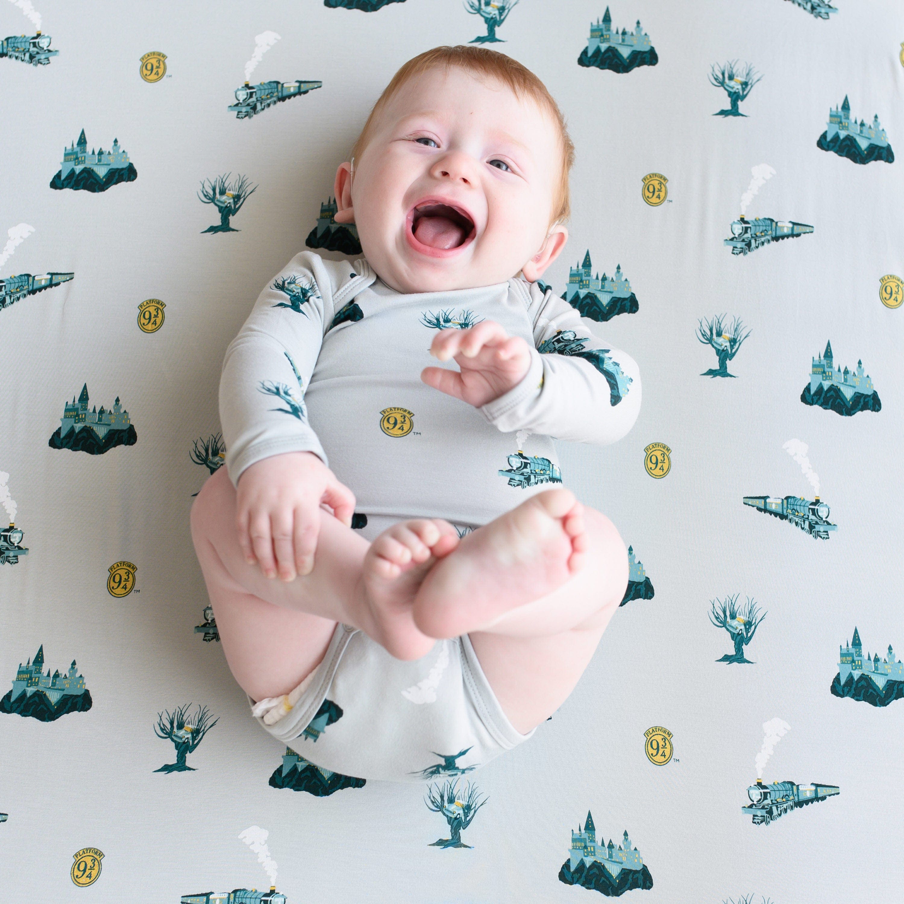 Infant laying on Kyte Baby Crib Sheet in  Journey